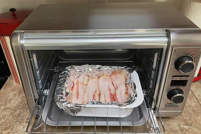 Bacon Being Cooked in a Toaster Oven.